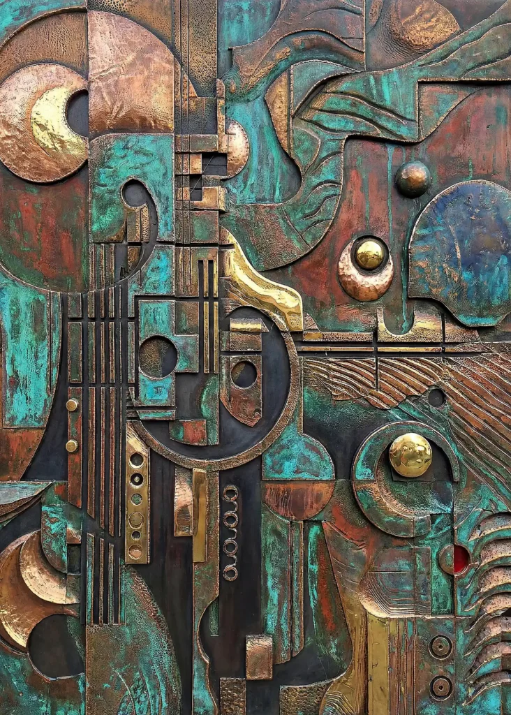 Weathered copper and verdigris textures define this complex relief sculpture of interlocking geometric shapes and circular patterns. This industrial-style assemblage evokes a sense of mechanical history through its rich patina and architectural layers. Artwork by Constantine Cheshire