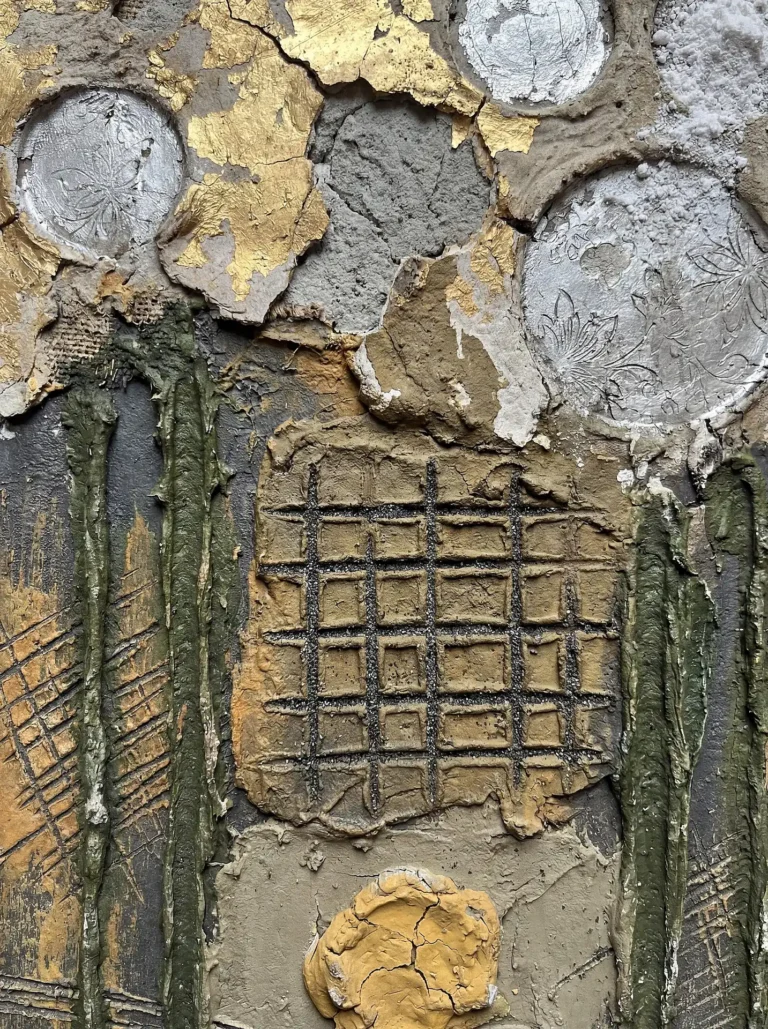 Golden light reflects off metallic leaf and embossed silver discs in this heavily textured mixed media artwork. The piece combines industrial elements like cracked clay and grid patterns with delicate floral motifs in a sophisticated earth-toned palette. Artwork by Constantine Cheshire