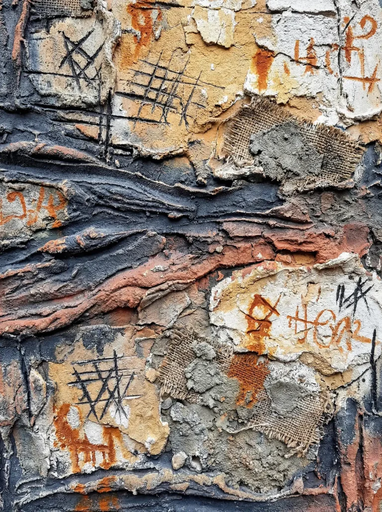 Gritty and industrial, this mixed media piece features layers of peeling plaster, frayed burlap, and charcoal markings in a palette of rust and gray. The heavy textures and weathered surfaces create a sense of urban decay and modern complexity. Artwork by Constantine Cheshire