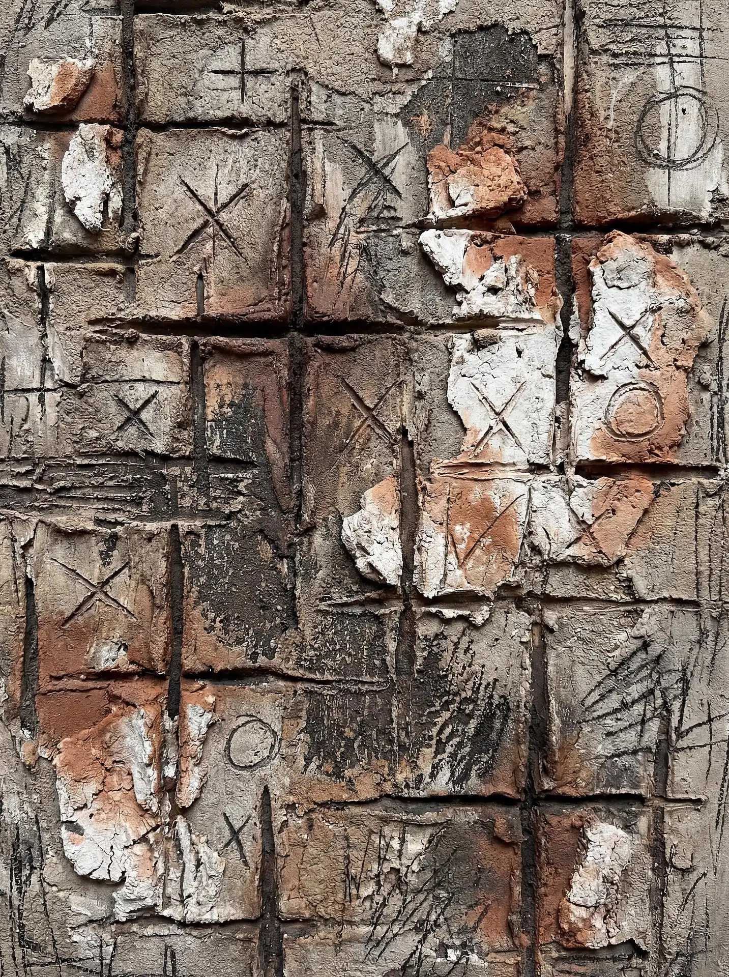 Etching deep lines into a crumbling surface, this abstract composition captures the gritty interplay of weathered plaster and hand-drawn charcoal markings. The industrial artwork blends earthy terracotta tones with cool grey concrete and deep grooves to evoke a sense of urban history and tactile grit. Artwork by Constantine Cheshire