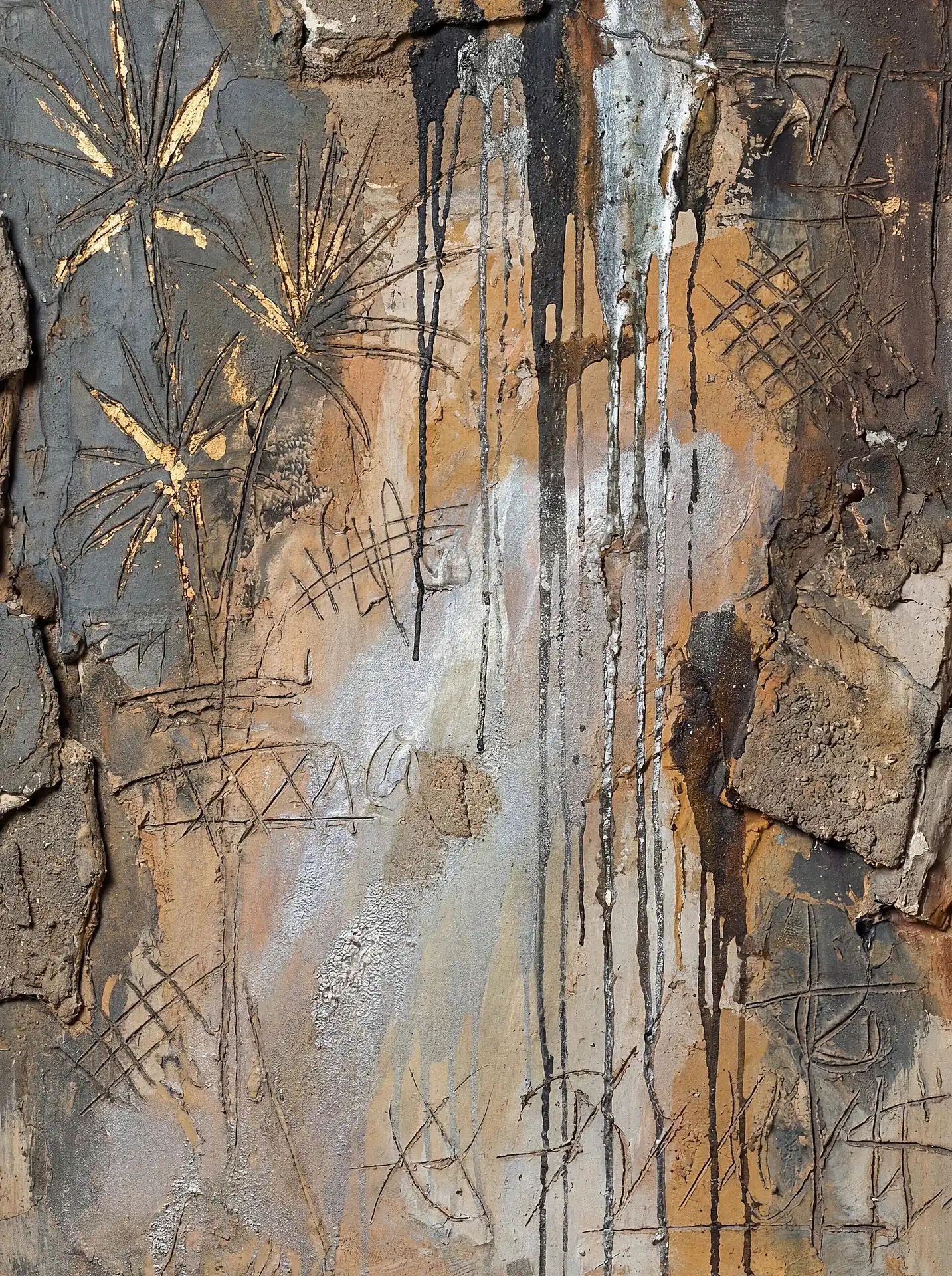Dripping downward in dark streaks, this mixed media piece combines gritty industrial textures with elegant gold leaf etchings. The composition features a blend of earthy brown plaster, metallic silver splashes, and delicate palm-like shapes for a modern rustic aesthetic. Artwork by Constantine Cheshire