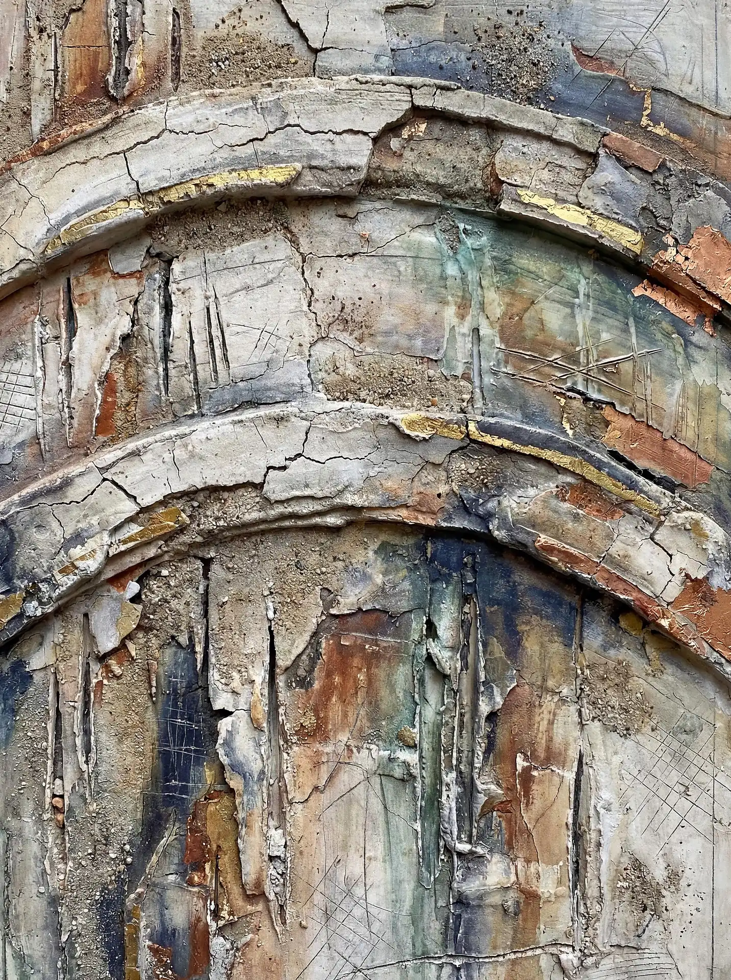 Evoking a sense of timeless decay and archaeological discovery, this mixed media work features thick plaster layers, deep fissures, and subtle gold leaf accents. The composition blends earthy terracotta tones with cool blues across a heavily distressed and arched architectural surface. Artwork by Constantine Cheshire