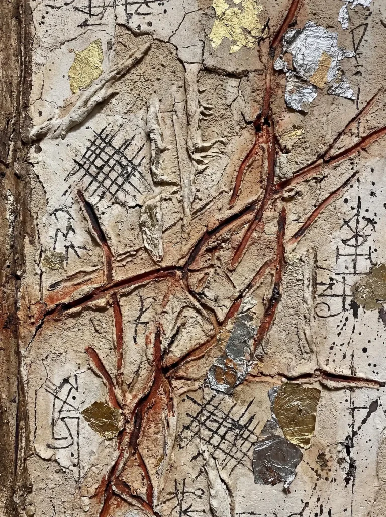 Spreading across the cracked plaster surface, this abstract composition blends primitive ink symbols with shimmering gold and silver leaf. The weathered tan texture is punctuated by deep red recessed lines and industrial black crosshatching, creating a mood of archaeological discovery and contemporary grit. Artwork by Constantine Cheshire