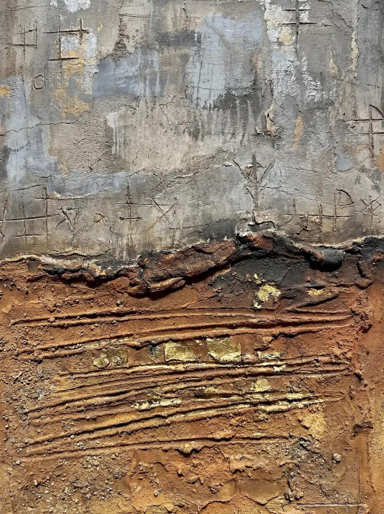 Gray and ochre tones define this textured abstract piece featuring carved symbolic markings and shimmering gold leaf accents. The heavy impasto surface combines industrial cement aesthetics with warm earth tones and charred elements for a modern, tactile feel. Artwork by Constantine Cheshire