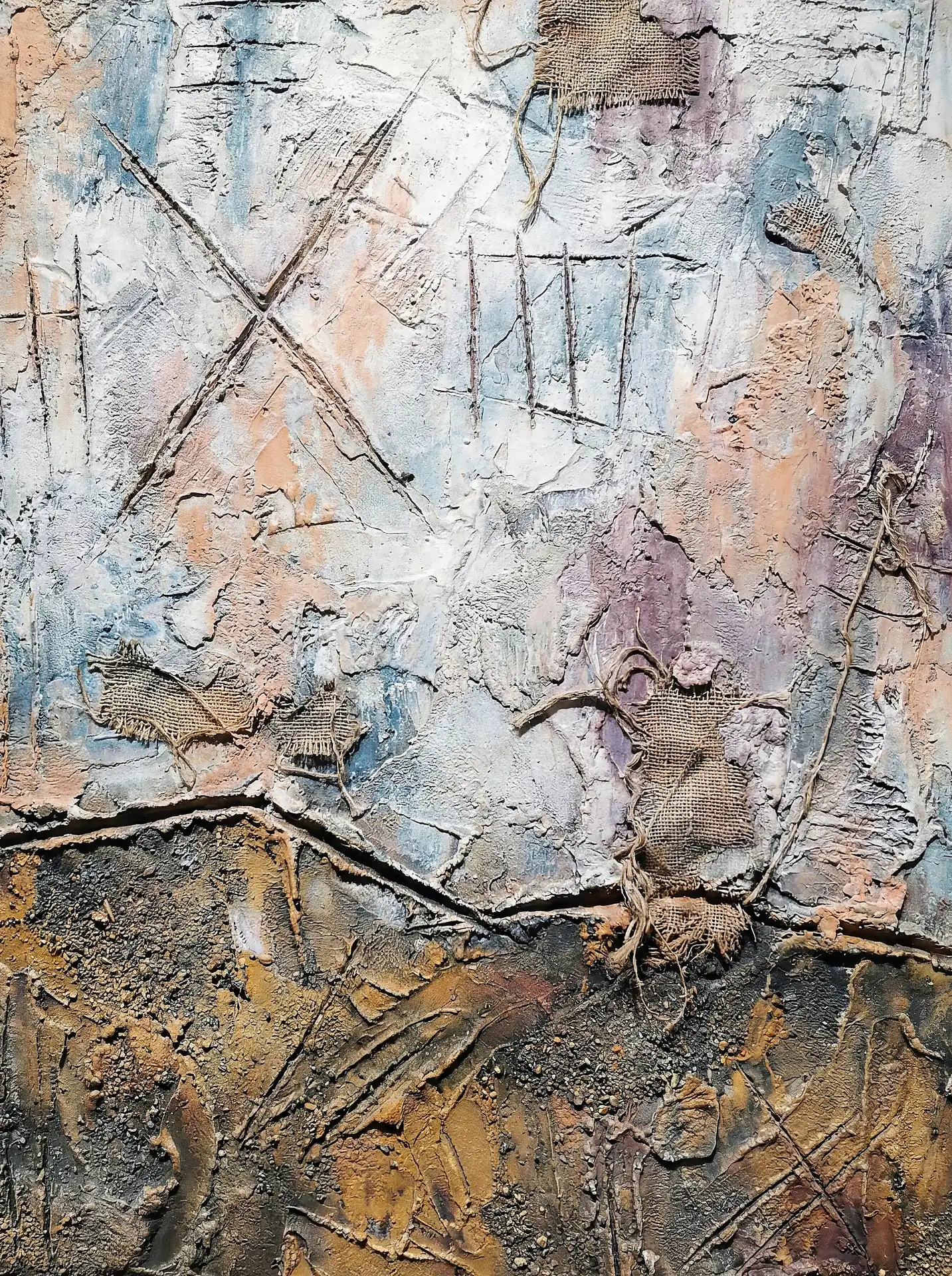 Atmospheric and weathered, this abstract piece features heavy plaster impasto, embedded burlap scraps, and scratched tally markings in earthy tones. The combination of white, ochre, and muted blue creates a tactile, aged surface ideal for rustic or industrial decor. Artwork by Constantine Cheshire