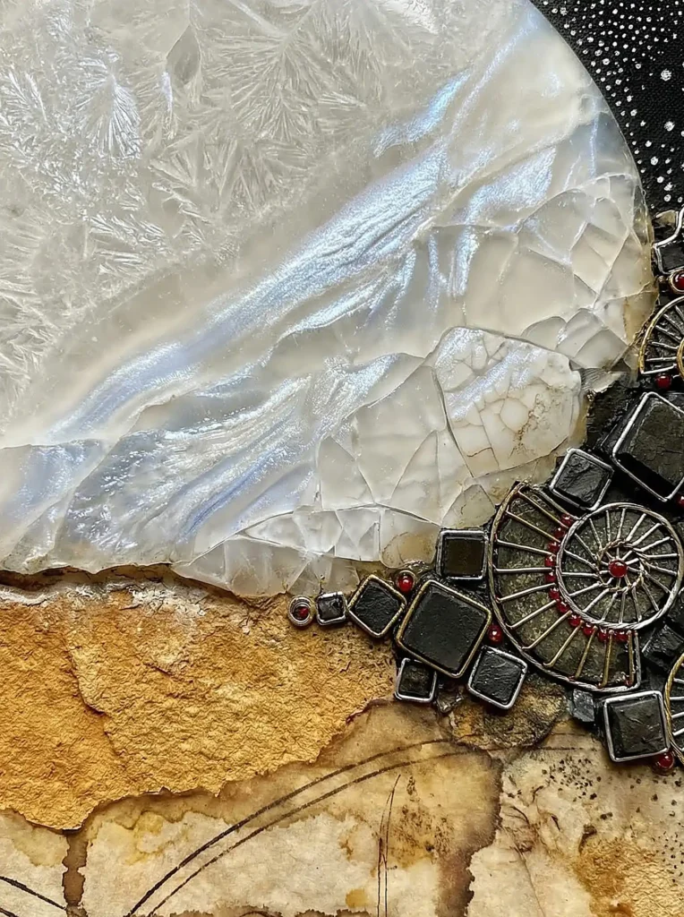 Swirling across the composition, an intricate metallic spiral meets translucent white agate and weathered ochre paper. This abstract mixed-media artwork combines organic mineral textures with geometric industrial elements in a palette of silver, charcoal, and warm earth tones. Artwork by Constantine Cheshire