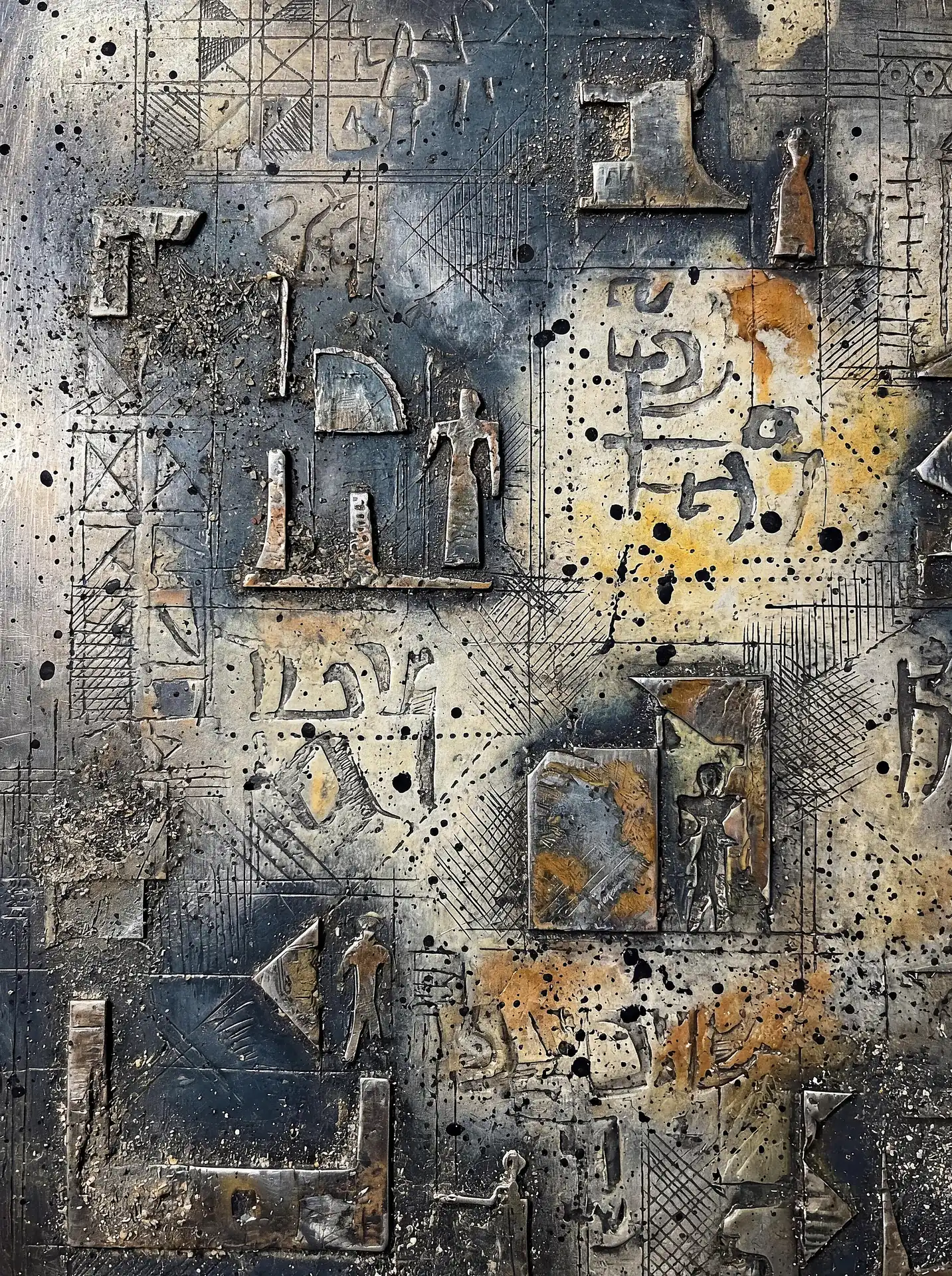 Abstract relief sculpture featuring raised metallic shapes, etched geometric patterns, and splattered ink on a weathered surface. This mixed media piece blends industrial and archaeological styles with rich gold highlights and charcoal tones to create a sense of ancient machinery or cryptic maps. Artwork by Constantine Cheshire