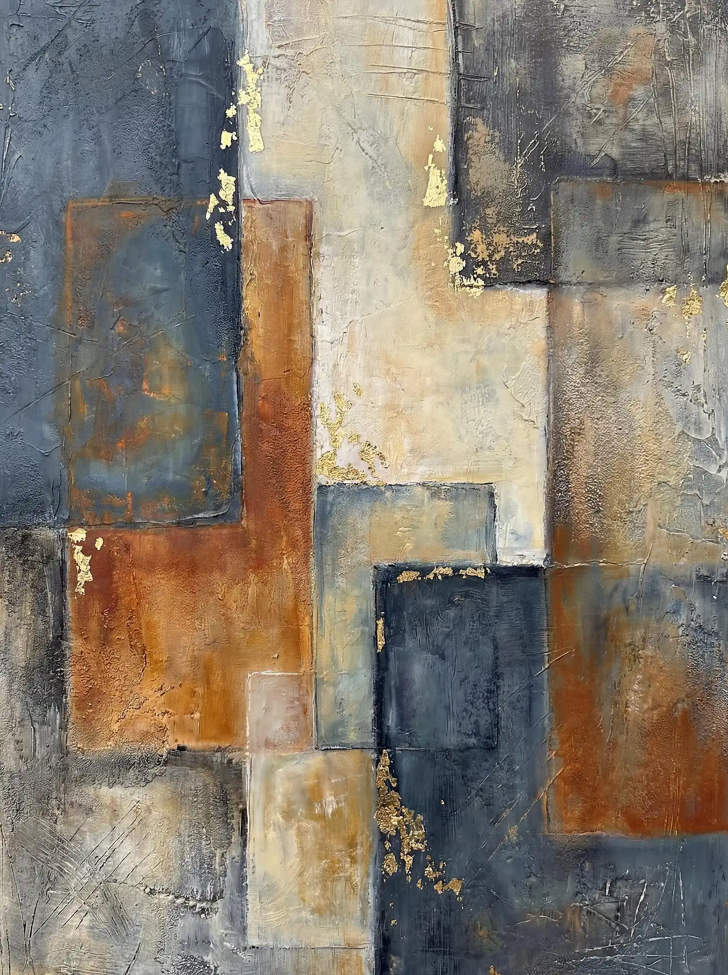 Layering of rectangular forms creates a structured yet rustic composition using navy blue, burnt sienna, and cream hues. This mixed media piece features heavy impasto textures and shimmering gold leaf accents that add a sophisticated, modern metallic touch to the industrial aesthetic. Artwork by Constantine Cheshire