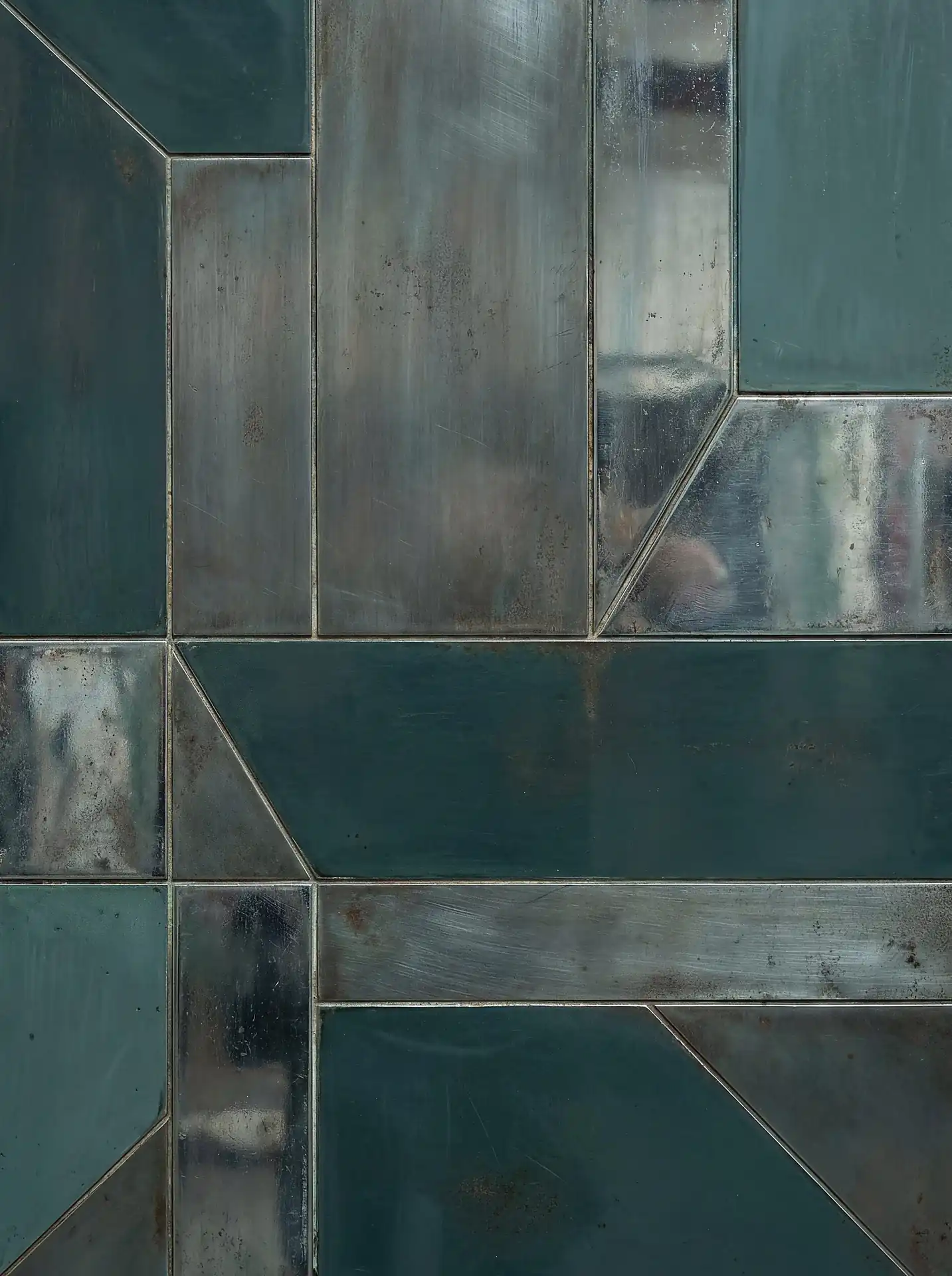 A layered arrangement of rectangular and angular panels creates a structured geometric mosaic with an industrial aesthetic. This contemporary artwork features a moody palette of deep teal and tarnished silver with distressed metallic textures and aged patina details. Artwork by Constantine Cheshire