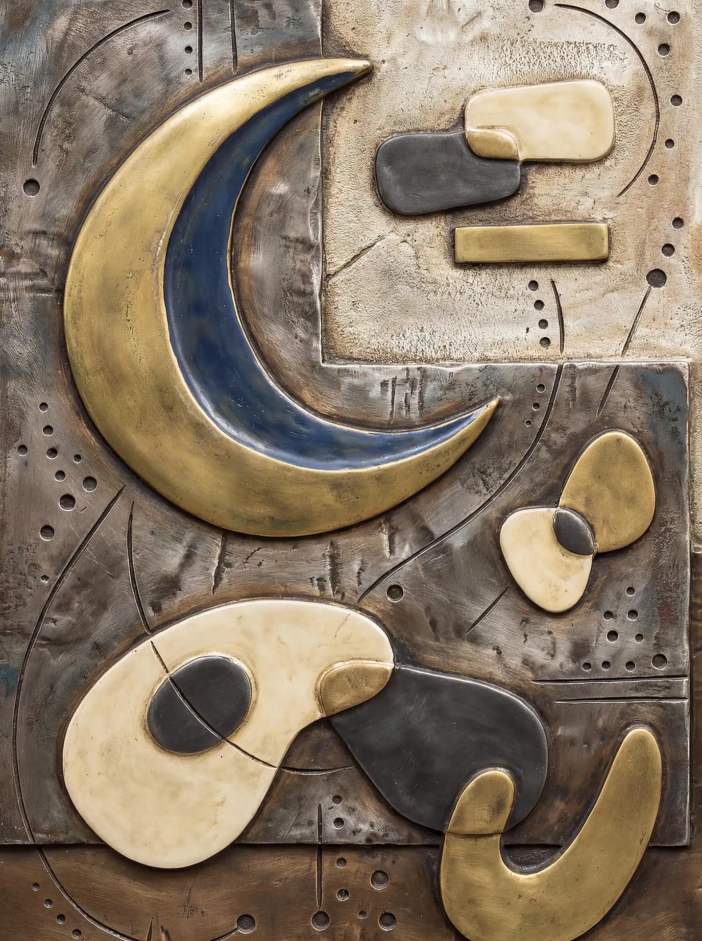 Timeless and contemplative, this mixed metal relief features a large golden crescent moon alongside abstract cream and charcoal shapes. The surface is rich with hand-tooled textures including fine stippling and industrial scuffs. Artwork by Constantine Cheshire