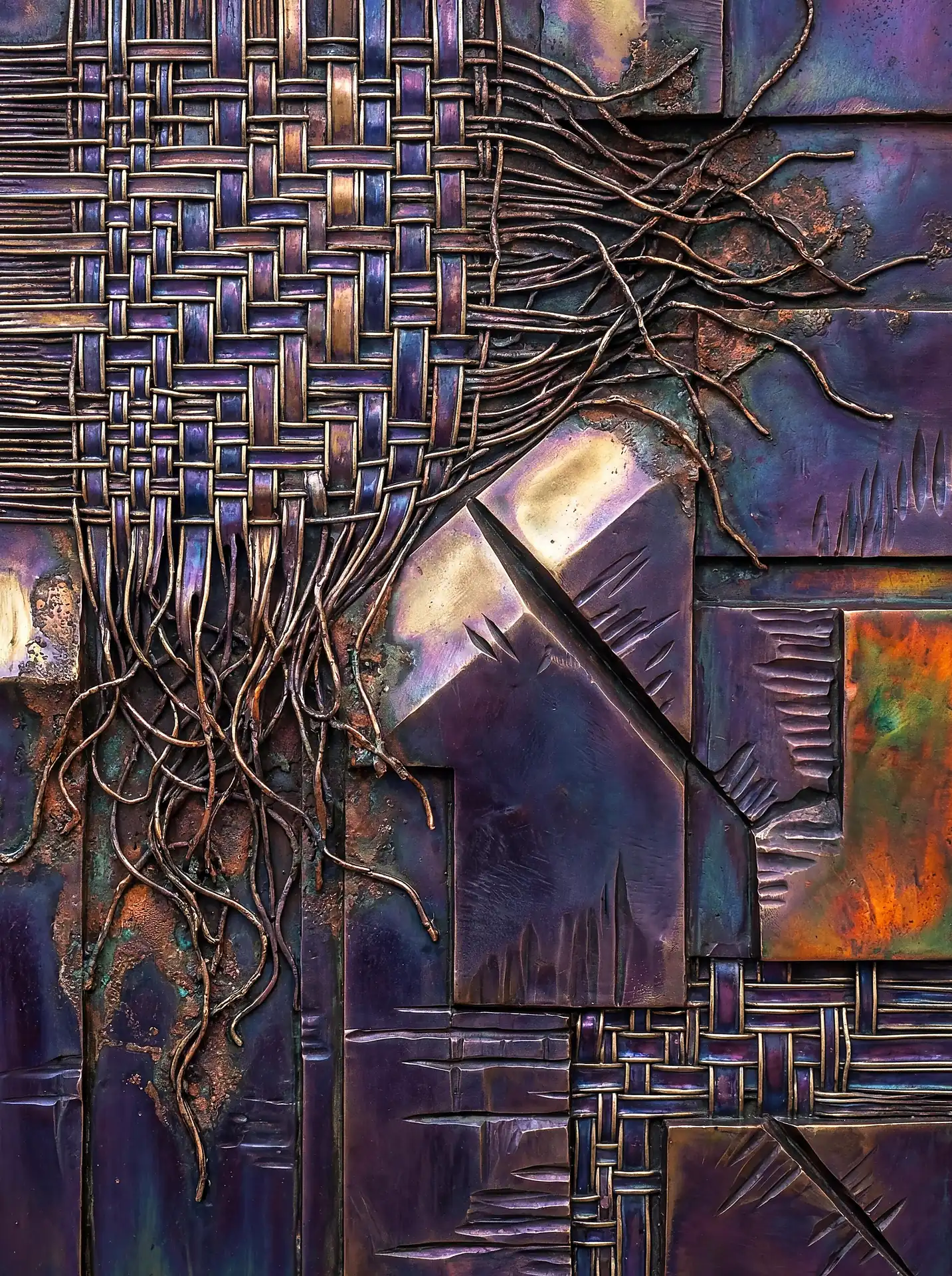 Deep iridescent purple and amber tones illuminate this mixed media relief featuring intricate woven copper bands and weathered metal plates. This industrial abstract piece showcases a blend of textile-inspired metalwork and rugged, heat-treated textures for a complex tactile appearance. Artwork by Constantine Cheshire